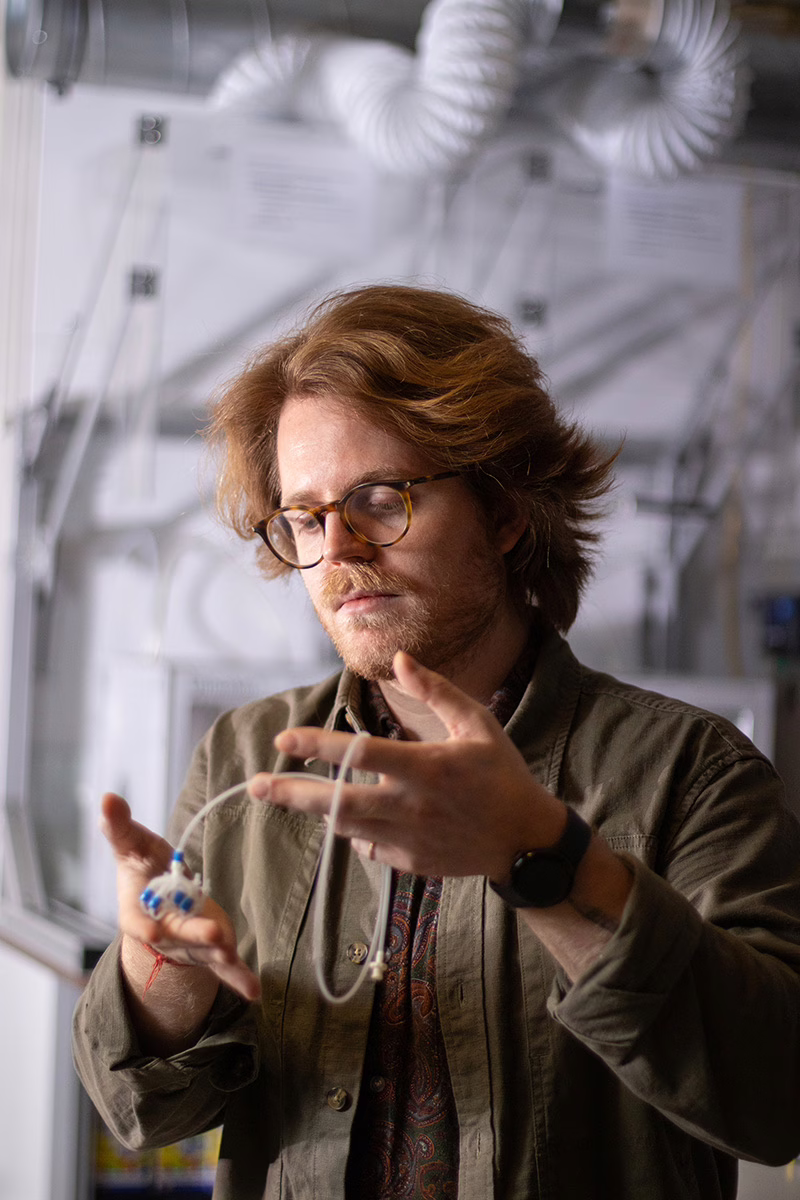 Alberto Comoretto and his insect-like soft robot in the lab